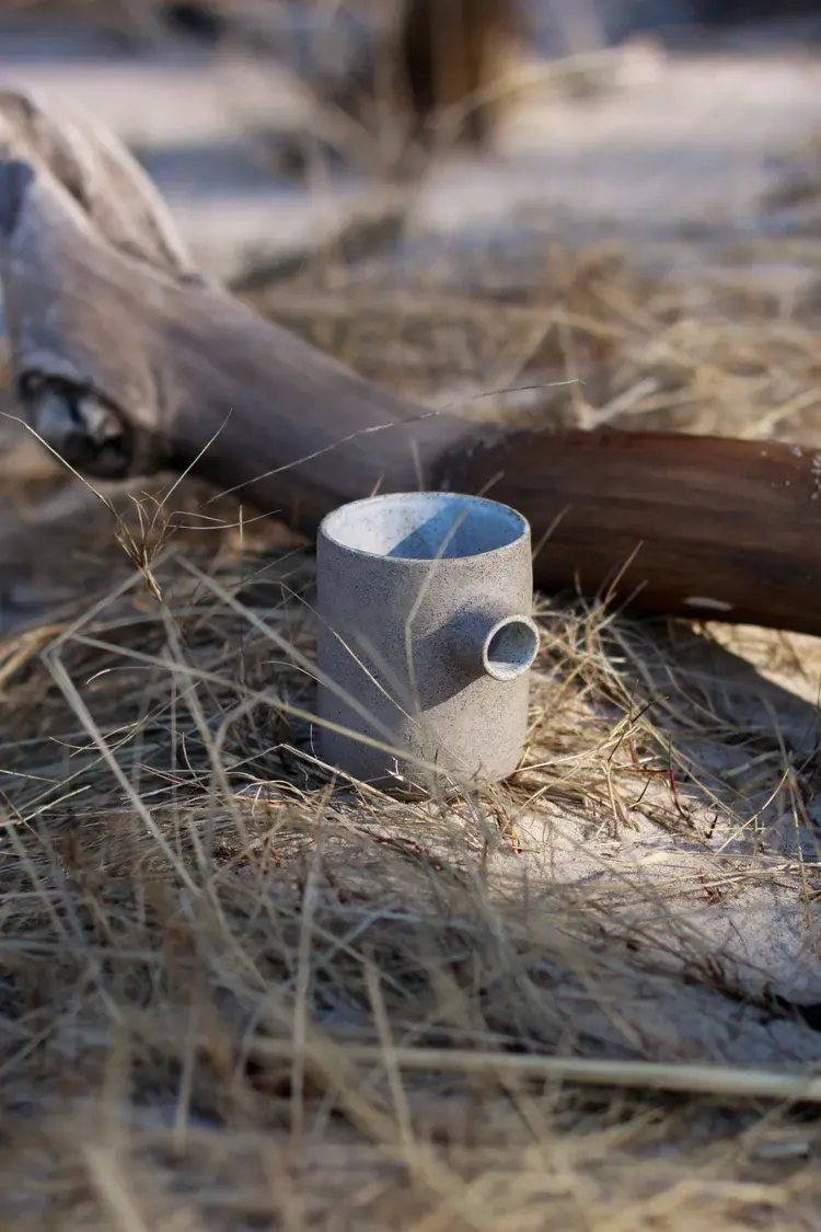 Close-up of hand-built pottery showing coil texture