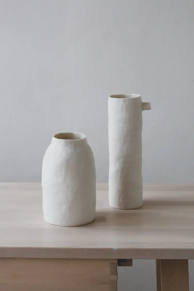 Pair of hand-built porcelain bottles in muted tones