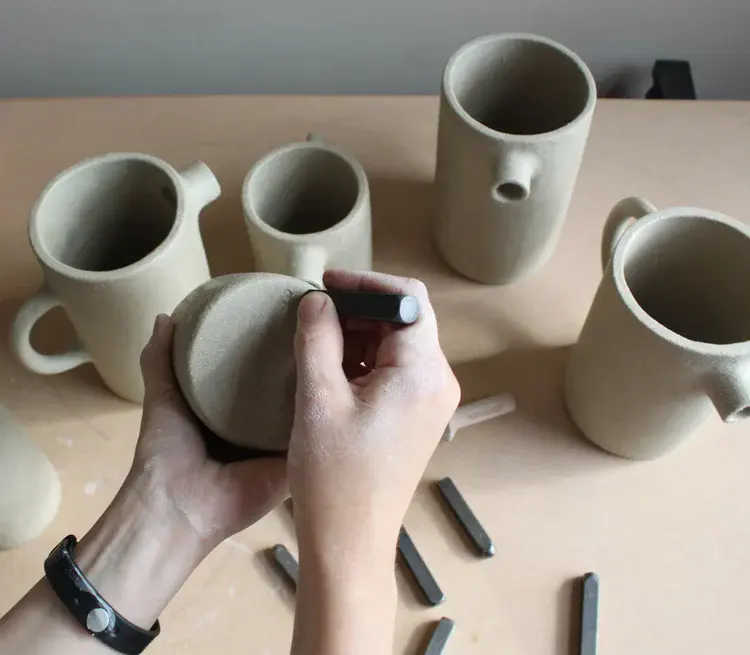 White glazed seagull jug with curved handle