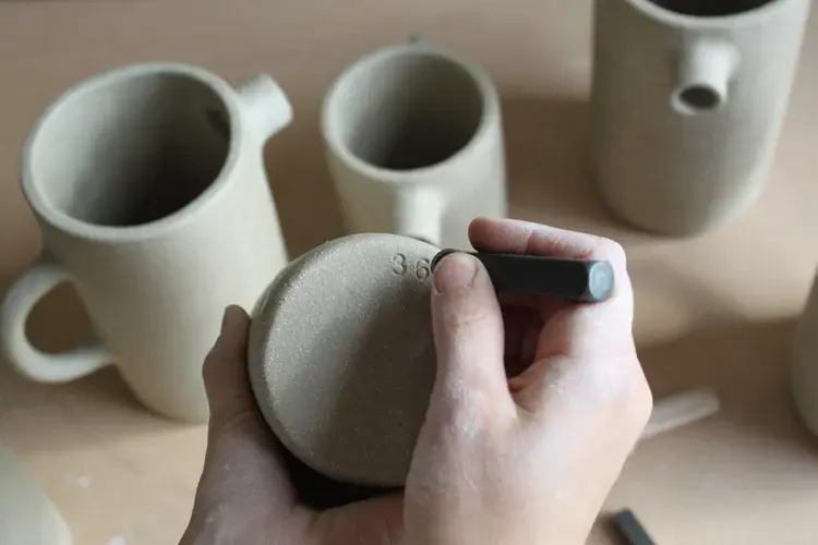 Seagull jug with flowers on wooden table