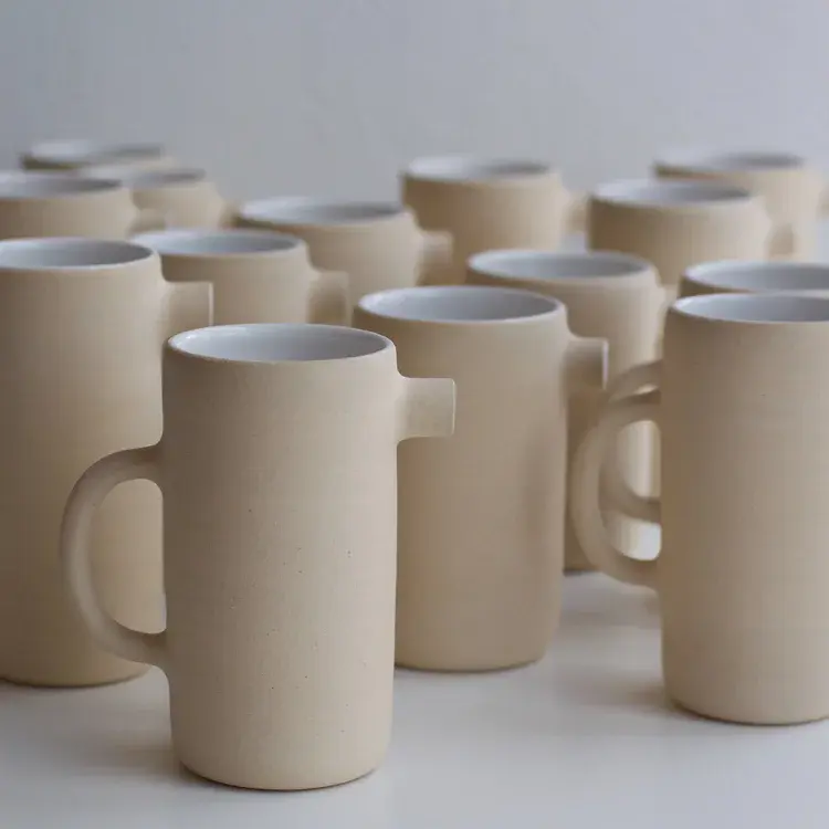 Wheel-thrown seagull jug with smooth white glaze