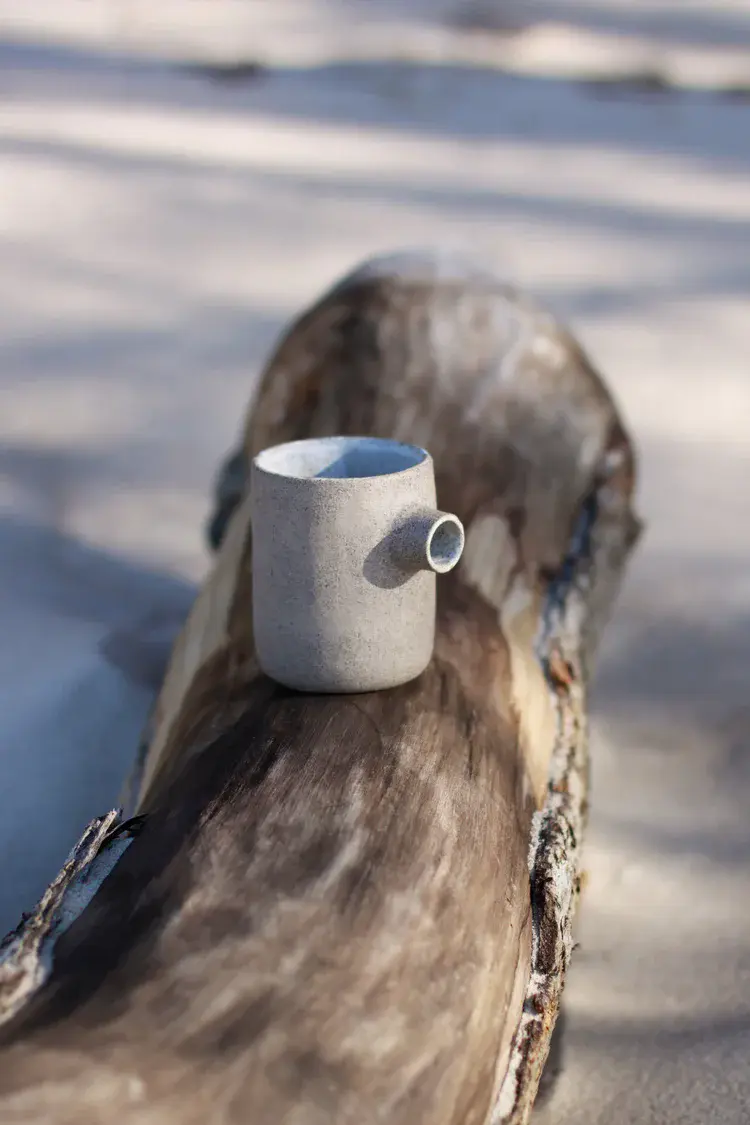 Seagull jug trio displayed on rustic shelf