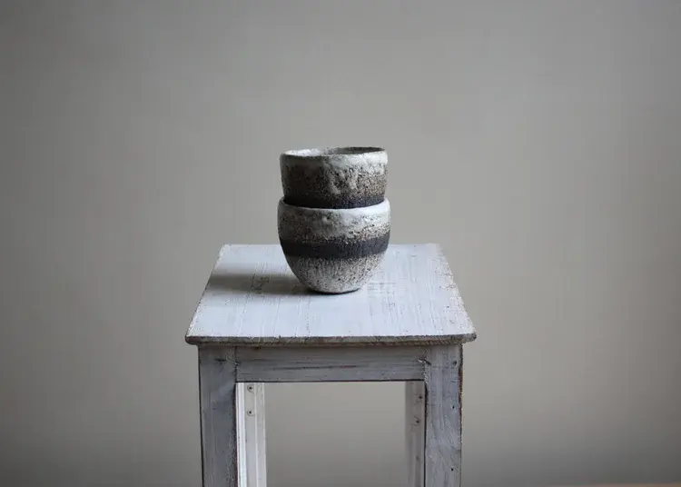 Coil-built stoneware vase with natural texture