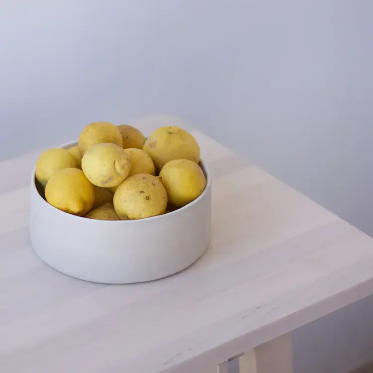 Coil-built stoneware bowl with matte nude glaze