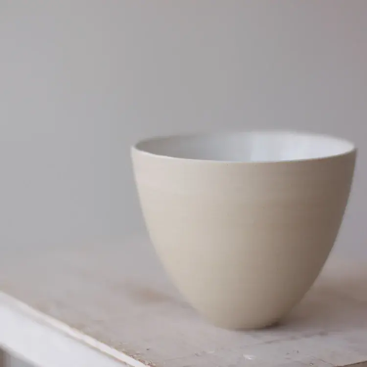 Stoneware serving dish with rustic uneven rim