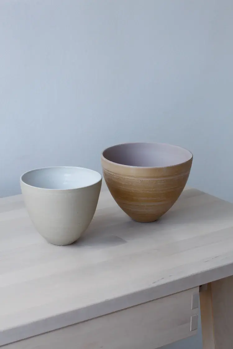 Pair of stoneware vessels in soft neutral tones