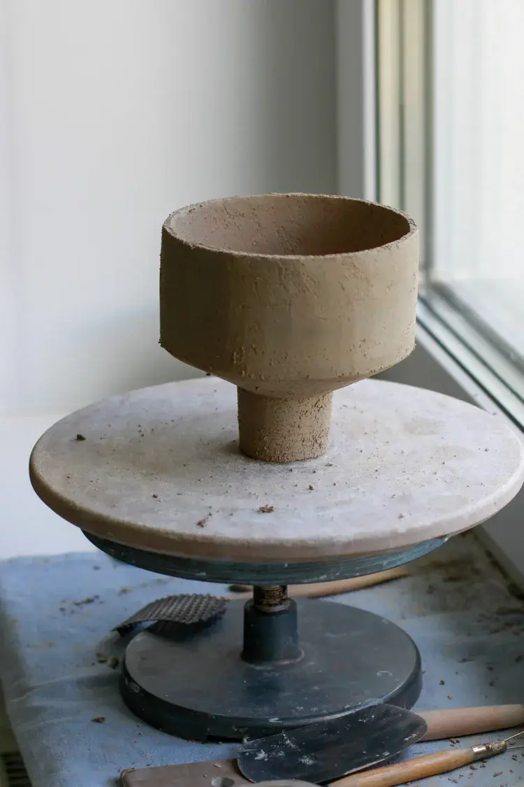 Stoneware storage jar with hand-formed lid