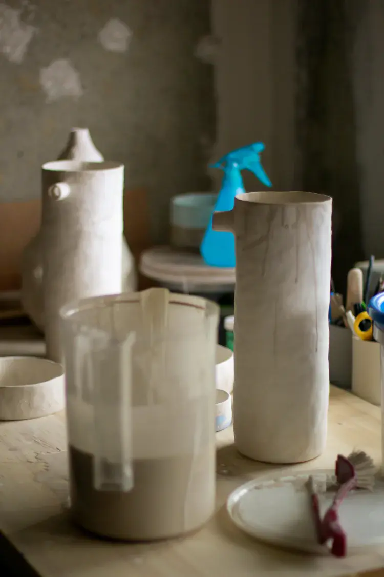 Work in progress ceramic pieces on drying rack