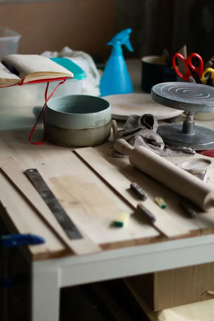 Studio atmosphere with natural light and clay dust